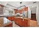 Gourmet kitchen with custom wood cabinets, granite countertops, and stainless-steel appliances at 4920 Sw 4Th Cir, Ocala, FL 34471