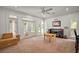 Play room with neutral color palette, multiple windows, and access to the backyard at 4920 Sw 4Th Cir, Ocala, FL 34471