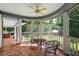 Cozy screened porch featuring neutral tile flooring and peaceful views of the yard at 4920 Sw 4Th Cir, Ocala, FL 34471