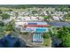 Active community featuring a pool, recreation area, and a pond surrounded by homes at 501 Santa Fe Rd, Tavares, FL 32778