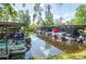 Covered boat slips along a calm canal, perfect for boating enthusiasts and water lovers at 501 Santa Fe Rd, Tavares, FL 32778