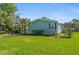 Lovely single-story home featuring a manicured lawn, carport, and charming curb appeal at 501 Santa Fe Rd, Tavares, FL 32778