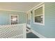 Cozy patio area adjacent to the home with privacy lattice for added appeal at 501 Santa Fe Rd, Tavares, FL 32778