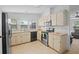 Well-equipped kitchen featuring modern appliances, bright cabinets, and ample counter space at 501 Santa Fe Rd, Tavares, FL 32778