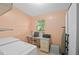 Multi-functional laundry room with a workspace including a desk, drawers, and window at 501 Santa Fe Rd, Tavares, FL 32778