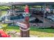 Marina Park sign points to a vibrant boat dock with covered slips and nautical decor at 501 Santa Fe Rd, Tavares, FL 32778