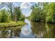 Picturesque waterway with lush greenery and a charming lighthouse, ideal for nature lovers at 501 Santa Fe Rd, Tavares, FL 32778