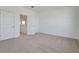An unfurnished bedroom featuring plush carpeting and a walk-in closet at 5173 Waypointe Blvd, Apopka, FL 32712