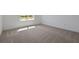 Neutral bedroom with a carpeted floor, white trim and baseboards, plus a window bringing in natural light at 5173 Waypointe Blvd, Apopka, FL 32712