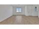 Unfurnished Living room with wood-look flooring, recessed lighting and a large window at 5173 Waypointe Blvd, Apopka, FL 32712