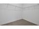 Walk-in closet with wire shelving and neutral carpet providing ample storage and organization at 5173 Waypointe Blvd, Apopka, FL 32712