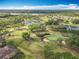Golf course community with ponds and lakes viewed from above at 602 Camino Real Blvd # 602, Howey In The Hills, FL 34737