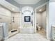 Bathroom with large tub, walk-in shower, and separate toilet room at 602 Camino Real Blvd # 602, Howey In The Hills, FL 34737