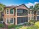Beautifully maintained two-story home with screened-in balcony and lush landscaping at 602 Camino Real Blvd # 602, Howey In The Hills, FL 34737