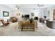 Cozy living room featuring neutral colors, a ceiling fan, carpet and an open layout for easy entertaining at 602 Camino Real Blvd # 602, Howey In The Hills, FL 34737
