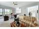 Inviting living room with comfortable seating, a ceiling fan, and sliding glass doors leading to the outdoor patio at 602 Camino Real Blvd # 602, Howey In The Hills, FL 34737