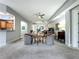Open-concept living room featuring neutral decor, chairs, and seamless flow at 602 Camino Real Blvd # 602, Howey In The Hills, FL 34737
