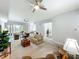 Expansive living room with a variety of seating arrangements and bright, airy atmosphere at 602 Camino Real Blvd # 602, Howey In The Hills, FL 34737