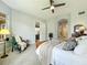 Sunlit primary bedroom with a view of the golf course at 602 Camino Real Blvd # 602, Howey In The Hills, FL 34737