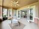Cozy outdoor patio with ceiling fan, opening to the bright and airy living area through French doors at 602 Camino Real Blvd # 602, Howey In The Hills, FL 34737