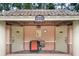 View of Wayne's Pool area offering convenient changing rooms with a lovely tiled roof and seating area at 602 Camino Real Blvd # 602, Howey In The Hills, FL 34737