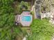 Aerial view of a backyard swimming pool featuring a covered outdoor living space at 602 Camino Real Blvd # 602, Howey In The Hills, FL 34737