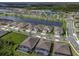 An aerial view of the neighborhood showing streets, pools, lakes, tennis courts, and a clubhouse at 6308 Mossy Oak Rd, St Cloud, FL 34771