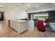 Open kitchen view of Gathering room with tile floors, recessed ceilings, with water views at 6308 Mossy Oak Rd, St Cloud, FL 34771