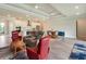 Open-concept living room featuring recessed ceilings, and an eat-in kitchen at 6308 Mossy Oak Rd, St Cloud, FL 34771