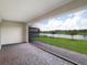 View from the covered patio of a lake and landscaping at 6308 Mossy Oak Rd, St Cloud, FL 34771