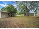 View of the backyard from the side of the house at 74 Stone Haven Ct, Leesburg, FL 34788