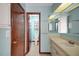 Bathroom featuring a single sink vanity, adjacent toilet and shower area at 74 Stone Haven Ct, Leesburg, FL 34788