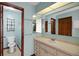 Bathroom featuring a single sink vanity, adjacent toilet and shower area at 74 Stone Haven Ct, Leesburg, FL 34788