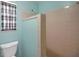 Full bathroom with a tiled shower and a window for natural light at 74 Stone Haven Ct, Leesburg, FL 34788