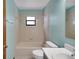 Bathroom featuring a single sink vanity, toilet, and bathtub with a showerhead at 74 Stone Haven Ct, Leesburg, FL 34788