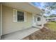 Welcoming entrance of a charming home with neat siding and well-kept outdoor features at 74 Stone Haven Ct, Leesburg, FL 34788