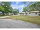 A charming one-story home with an attached garage in a peaceful neighborhood setting at 74 Stone Haven Ct, Leesburg, FL 34788