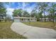 Charming one-story home with a well-maintained front lawn and driveway at 74 Stone Haven Ct, Leesburg, FL 34788