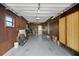 Spacious garage with lots of storage shelving and a work area at 74 Stone Haven Ct, Leesburg, FL 34788