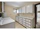 Laundry room featuring a counter and cabinet area, with a washer and dryer at 74 Stone Haven Ct, Leesburg, FL 34788