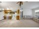 Bright open-plan living area featuring a view of the kitchen and comfortable seating at 74 Stone Haven Ct, Leesburg, FL 34788