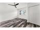 Bright bedroom offers a ceiling fan, wood-look floors and a window for natural light at 8198 Se 164Th Pl, Summerfield, FL 34491