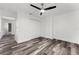 Bright bedroom offers wood grain floors, a ceiling fan and a double door closet at 8198 Se 164Th Pl, Summerfield, FL 34491
