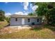 Home exterior view with clean lines, a private entrance, and minimalist landscaping at 8198 Se 164Th Pl, Summerfield, FL 34491