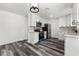 Updated kitchen features white cabinets, stainless steel appliances and wood-look floors at 8198 Se 164Th Pl, Summerfield, FL 34491