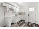 Bright, updated kitchen with white cabinets, marble backsplash, and new flooring at 8198 Se 164Th Pl, Summerfield, FL 34491
