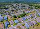 An aerial view of the neighborhood highlights the home's location in a well-maintained residential area at 910 Eagles Lndg, Leesburg, FL 34748