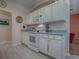 Bright, clean kitchen featuring a white oven and ample cabinet space for storage at 910 Eagles Lndg, Leesburg, FL 34748