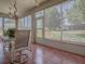 Enclosed lanai with tile flooring, ceiling fans, and lots of natural light at 910 Eagles Lndg, Leesburg, FL 34748