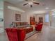 Inviting living room with comfortable seating, wood floors, and an open layout connecting to the dining area at 910 Eagles Lndg, Leesburg, FL 34748